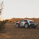 Porsche 911 Dakar parked in the desert with Rallye 1978 livery